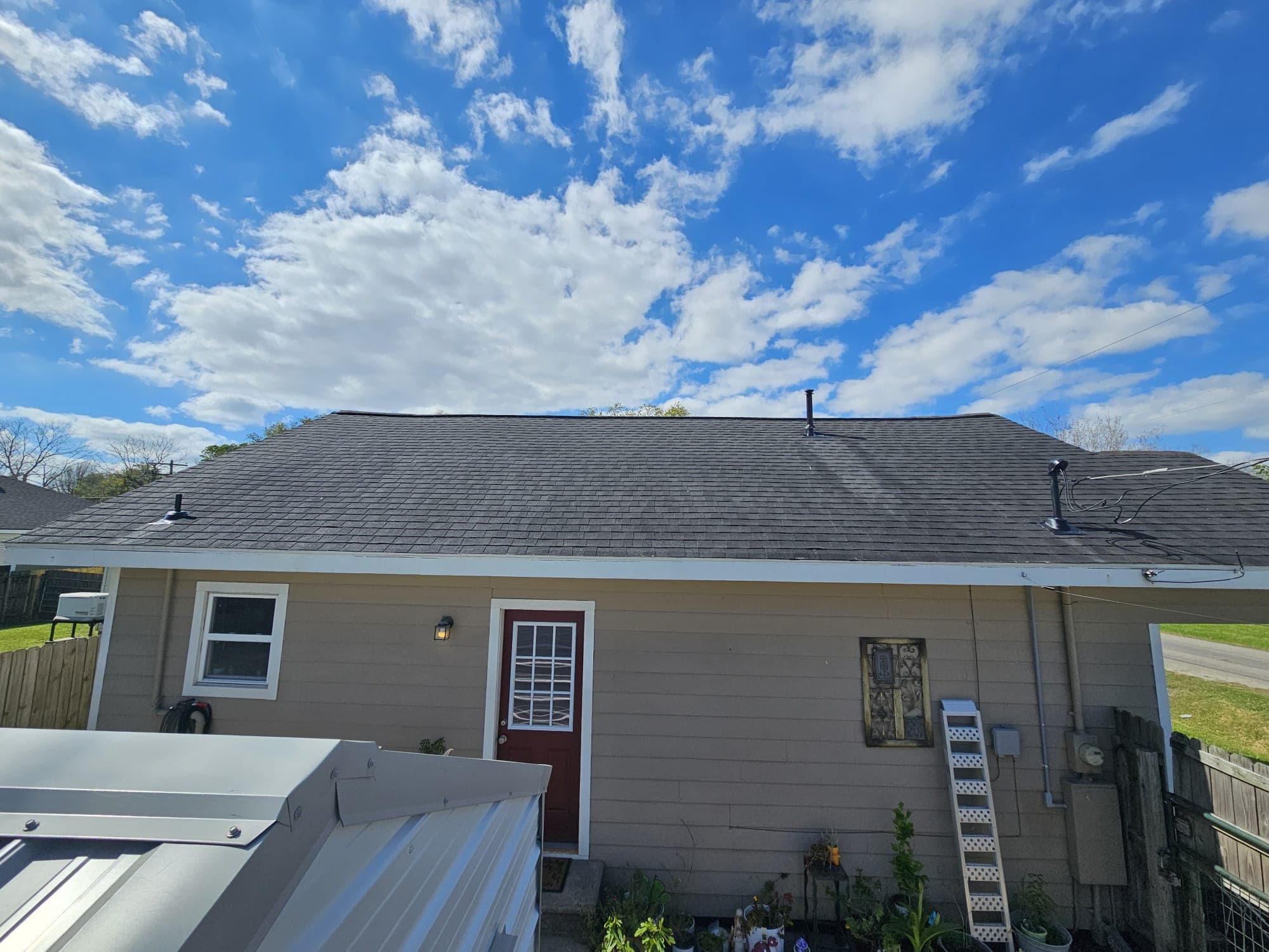 Same roof after Roof Rejoov bio-oil treatment — restored color, flexibility and waterproofing in Katy, Texas